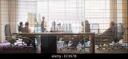 Business people watching presentation in conference room Stock Photo