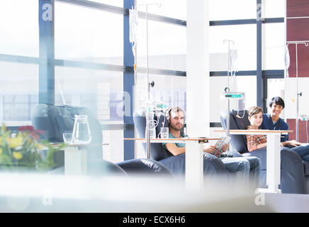 Patients receiving intravenous infusion in hospital Stock Photo