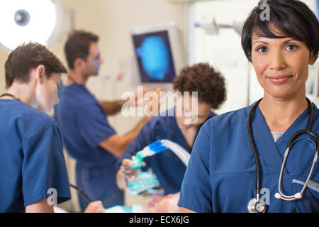 Portrait of female doctor in intensive care unit Stock Photo