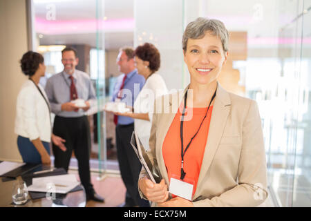 Portrait of confident senior businesswoman holding tablet pc Stock Photo
