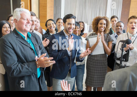 Group of people applauding after speech during conference Stock Photo