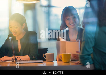 Businesswomen talking in office meeting Stock Photo