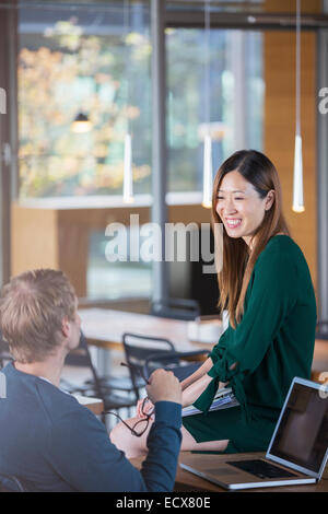 Business people talking at office desk Stock Photo