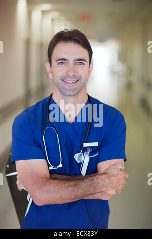 Portrait of male doctor in hospital corridor Stock Photo