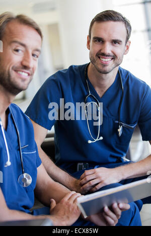 Portrait of two doctors with stethoscopes around necks in hospital Stock Photo