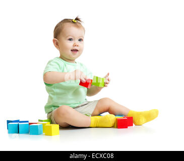 baby playing with colorful wood building blocks isolated Stock Photo