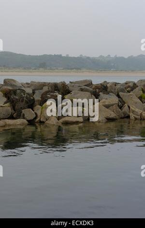 Rough boulders forming the break-water into the channel to Pwllheli ...