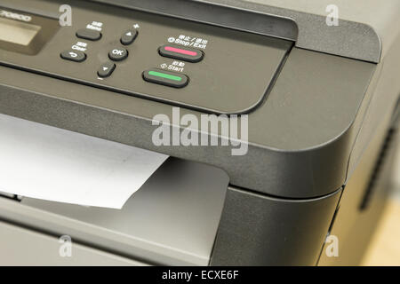 Close-up of printer printing documents on paper Stock Photo