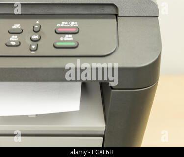 Close-up of printer printing documents on paper Stock Photo