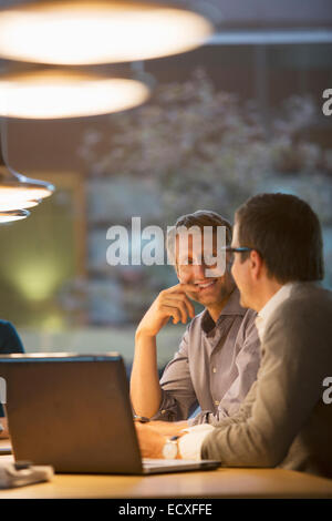 Businessmen talking in office meeting Stock Photo