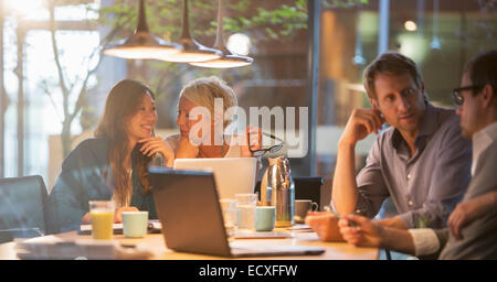 Businesswomen talking in office meeting Stock Photo