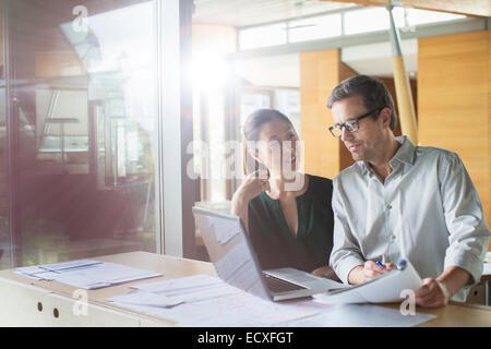 Business people working on laptop in office Stock Photo