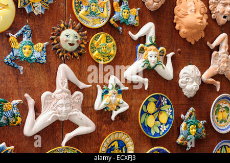 Pottery suns and Trinacria in tourist shops and Sicilian pottery Érice, Erice, Sicily Stock Photo