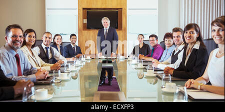 Business people posing in conference room Stock Photo