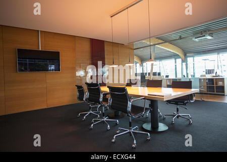 Conference table in empty office meeting room Stock Photo