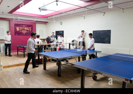 Teenagers playing table tennis in and after school club at the 'Wiff Waff Bar', a table tennis / Ping Pong sports games themed cafe bar,  Aberystwyth Wales UK Stock Photo