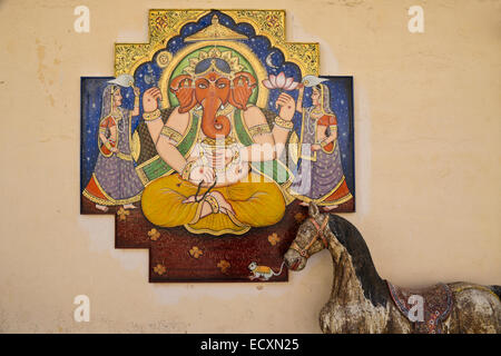 Colorful Mughal painting of Ganesh at maharaja's City Palace complex, Udaipur, Rajasthan, India Stock Photo