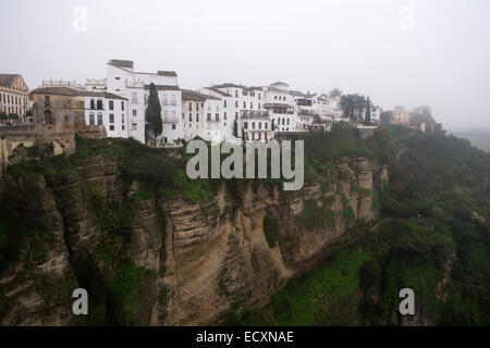 A view from Puente Nuevo bridge in Ronda, Spain on a cloudy and misty day Stock Photo