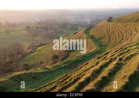 Prehistoric Britain. The ramparts and ditches of the ancient Iron Age hill fort at Hambledon Hill, overlooking the Blackmore Vale in Dorset, England. Stock Photo