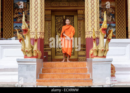 Young Buddhist Monk Standing And Smiling To The Camera Stock Photo