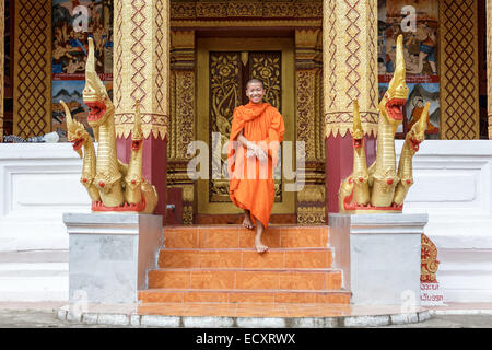 Young Buddhist Monk Walking And Smiling To The Camera Stock Photo
