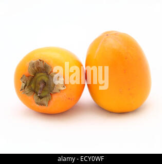 two persimmon on a white background Stock Photo