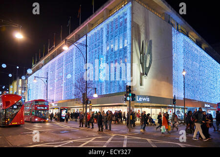 LONDON, UK - DECEMBER 20: Nighttime shot of John Lewis department store exterior in busy Oxford  street with wall of lights as p Stock Photo