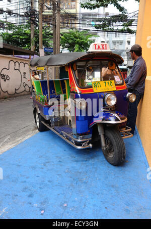 Tuk-tuk taxi in narrow street in Bangkok, Thailand Stock Photo