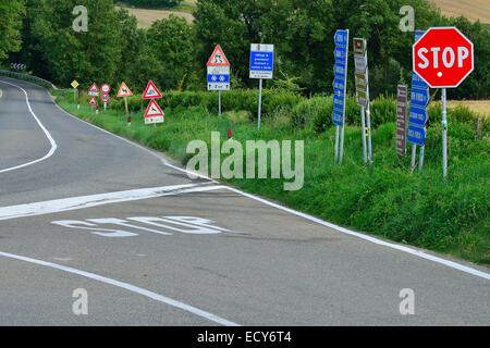 Forest of traffic signs at a crossroads in the Val d&#39;Orcia, Val d&#39;Orcia, Province of Siena, Tuscany, Italy Stock Photo