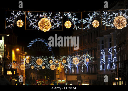 Brighton UK 2014 - Christmas Lights across North Street with the Brighton Wheel of Excellence lit up in background Stock Photo