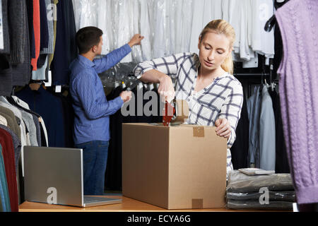 Couple Running Online Clothing Store Packing Goods For Dispatch Stock Photo