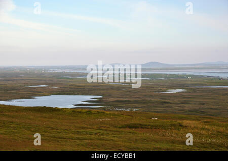View from Cleitreabhal a Deas, south east over Loch Steaphain to the coastal settlements of Cladach Chireboist North Uist Stock Photo