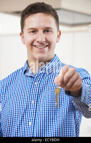 Happy Young Man Holding Keys To New Home Stock Photo