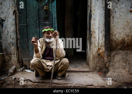 Old man in the streets of Old Delhi, INdia Stock Photo