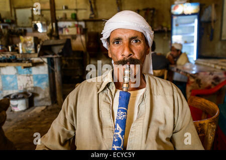 Men in traditional teahouse of smoking shisha, Egypt Stock Photo