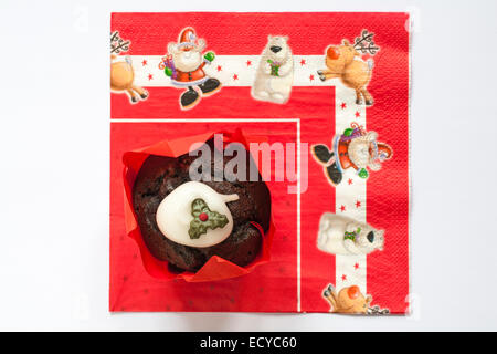 Tesco Merry Christmas Christmas Pudding Muffin on Christmas serviette Stock Photo