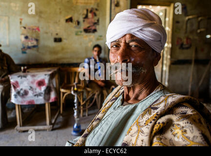 Men in traditional teahouse of smoking shisha, Egypt Stock Photo