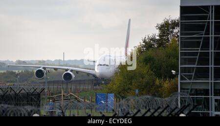 Airbus Coming around Hangar at Manchester Airport Emirates AIrways Airbus A6-EED A380-800 Stock Photo