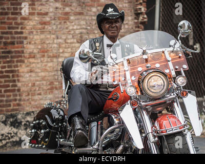 Senior African American man riding motorcycle Stock Photo