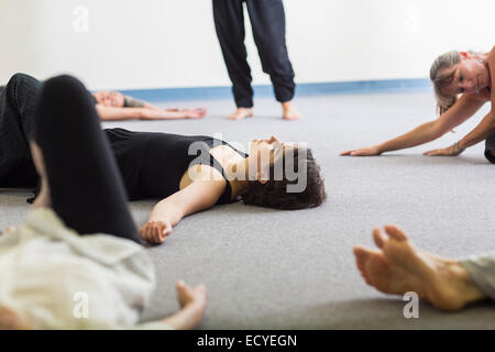 Students stretching in acting class Stock Photo