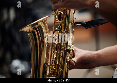 Close up of Caucasian man playing saxophone Stock Photo
