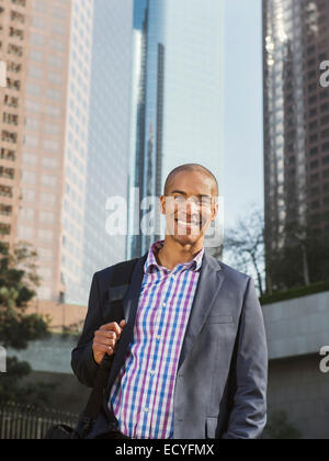 Black businessman standing in city Stock Photo