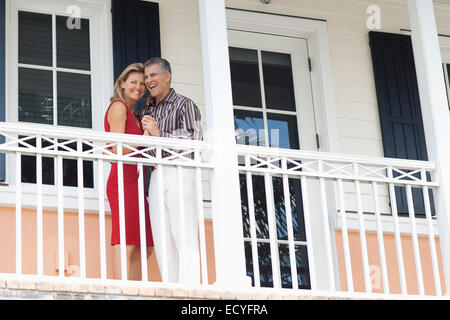 Caucasian couple dancing on balcony Stock Photo