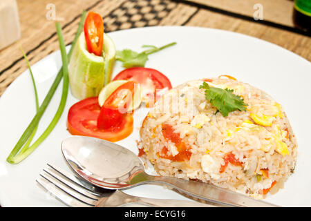 Thai dish: fried rice with meat Khao pad gai Stock Photo