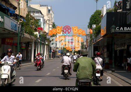 Motor scooters on Trang Tien street in Hanoi, Vietnam. Stock Photo