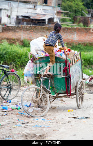 Girl gathering recycled plastic in Kathmandu, Nepal Stock Photo