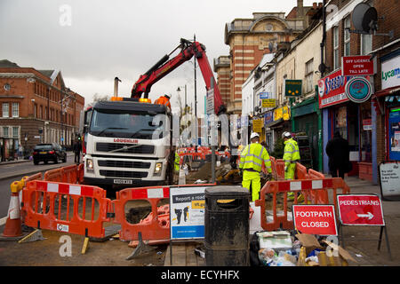 LONDON - DECEMBER 11TH: Loughlin labourers repaving the street on December the 11th, 2014, in London, England, UK. Loughlin is o Stock Photo