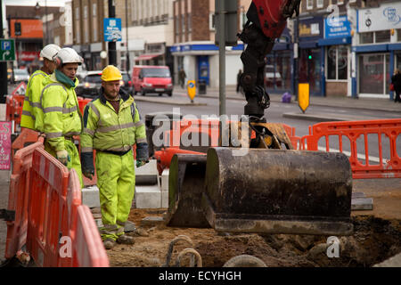 LONDON - DECEMBER 11TH: Loughlin labourers repaving the street on December the 11th, 2014, in London, England, UK. Loughlin is o Stock Photo