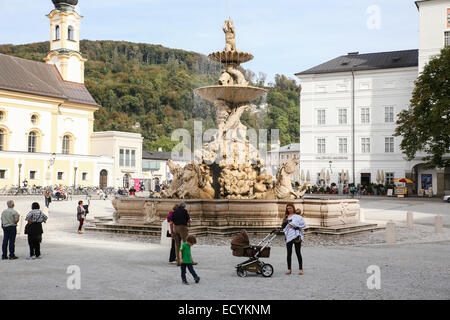 Residenzplatz water fountain Austria Salzburg Stock Photo