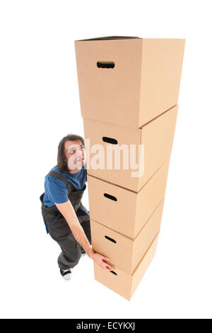 Mover with big stack of heavy boxes Stock Photo